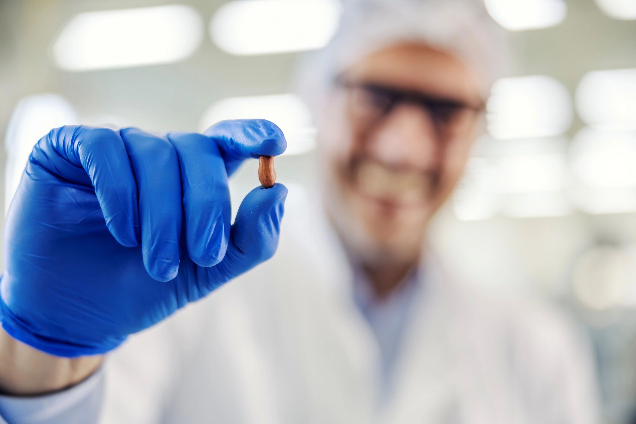 Food scientist inspecting product during quality control
